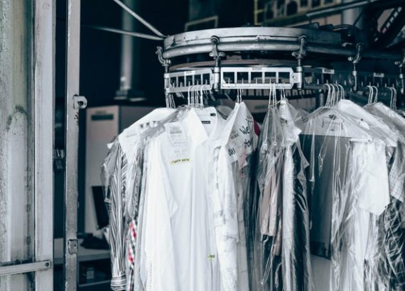 Customers clothes ready for collection in a small laundry shop